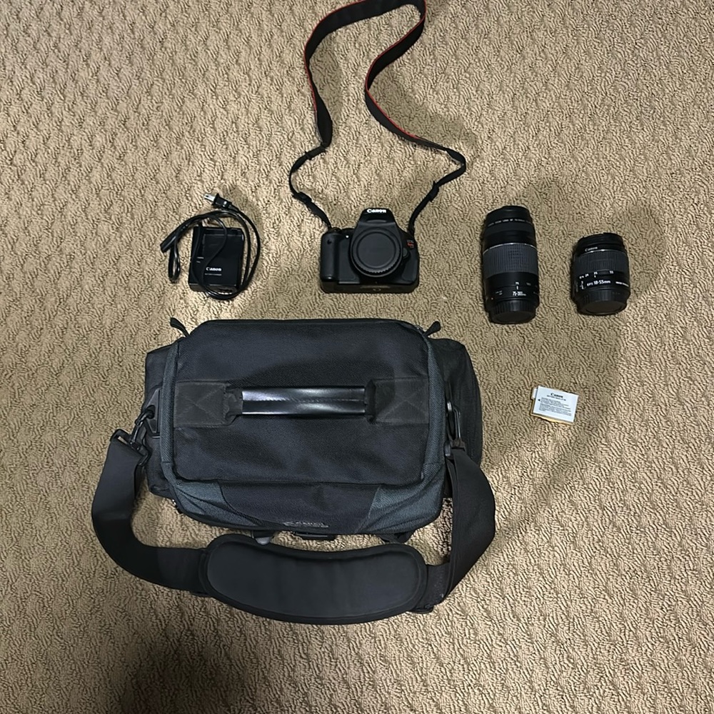 Canon eos rebel t3i with case and two lenses.